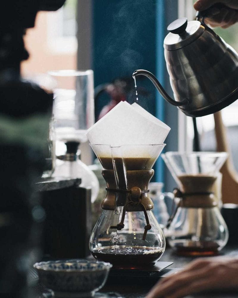Barista brewing pour-over coffee, brand photography for a Toronto café