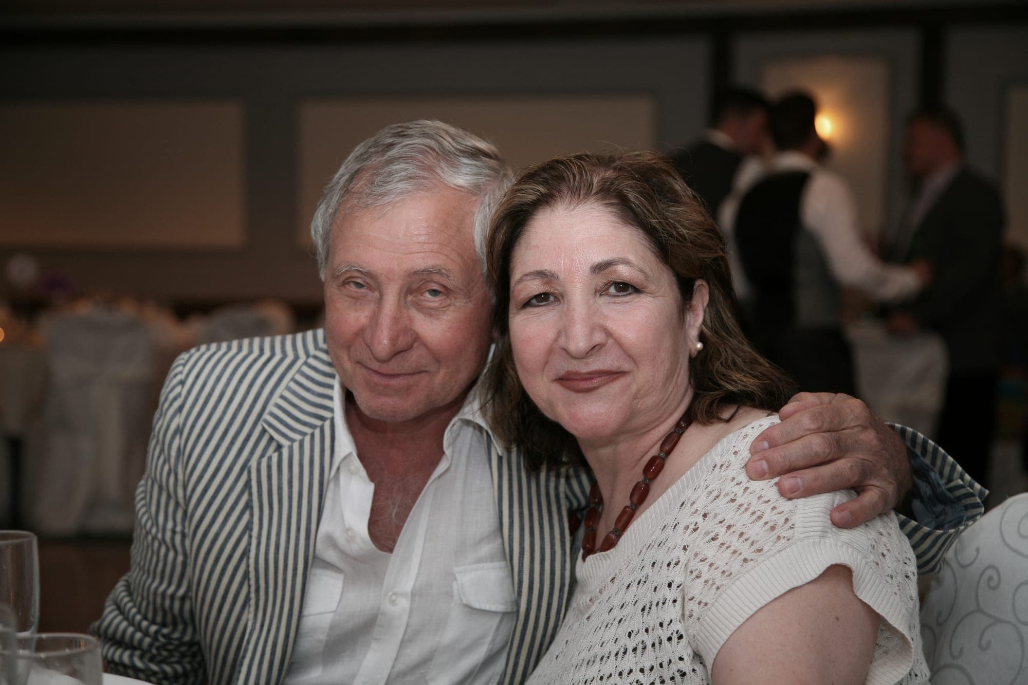 Candid portrait of a couple at an evening celebration