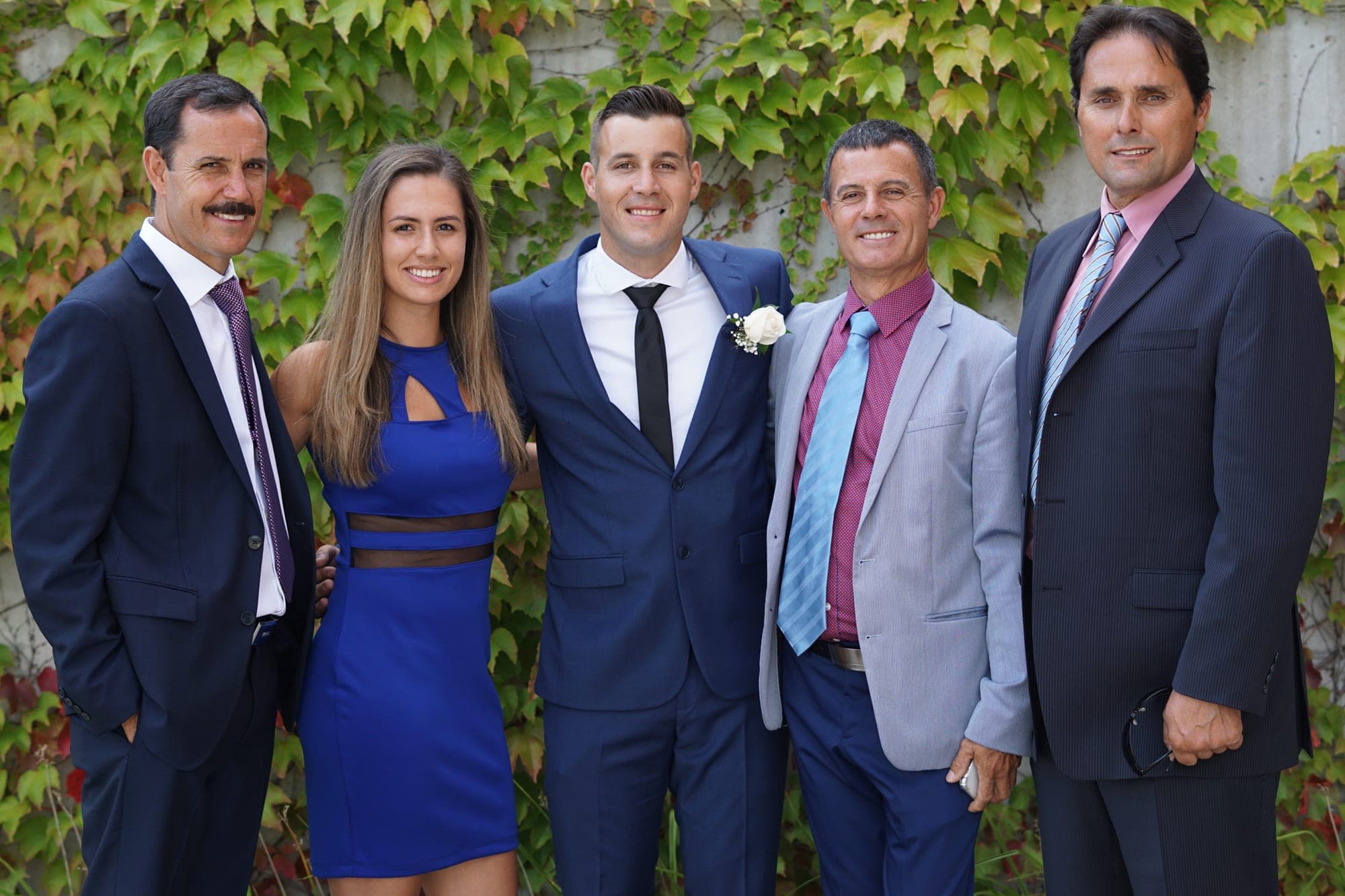 Extended family group portrait at an outdoor wedding
