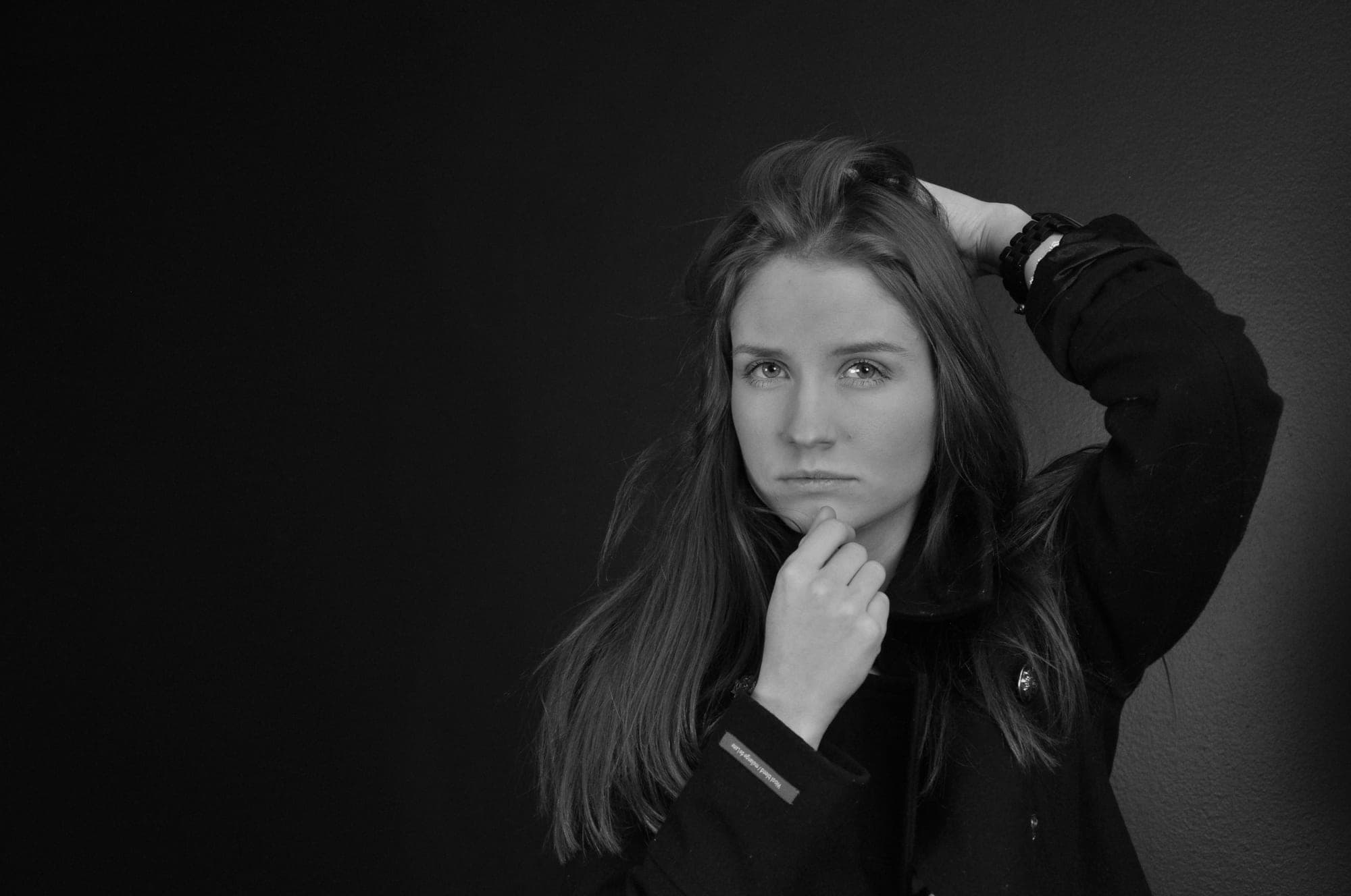 Black and white studio portrait of a young woman