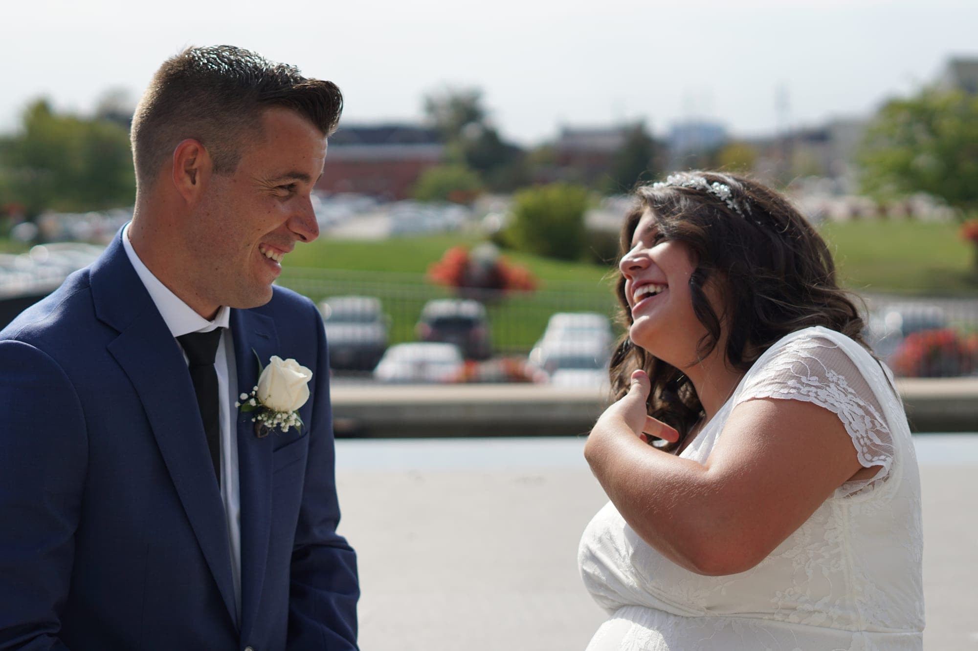 Bride and groom mid-laugh during their portrait session