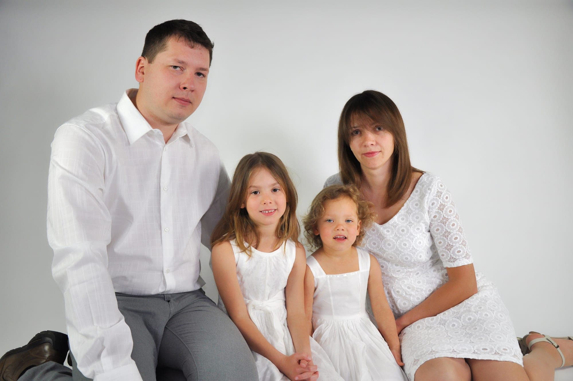 Family of four photographed together in a Toronto studio